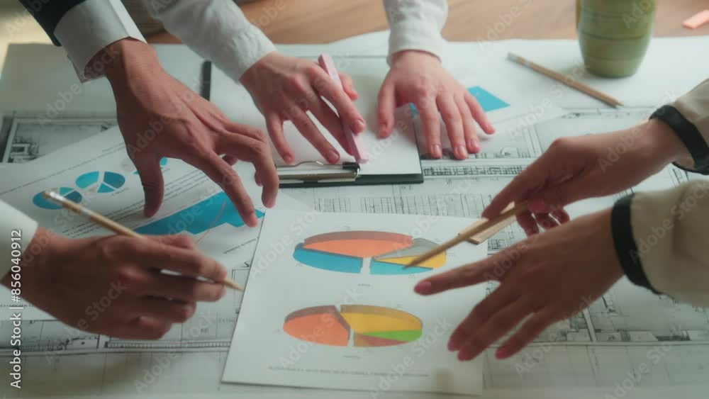 Paperwork on table office coworkers architects engineers contractors colleagues teamwork unrecognizable team business man women discussion architectural project documents blueprint graph plan on desk