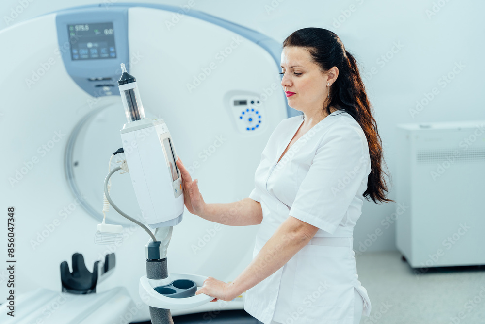 Fototapeta premium Technician standing in front of MRI scanner