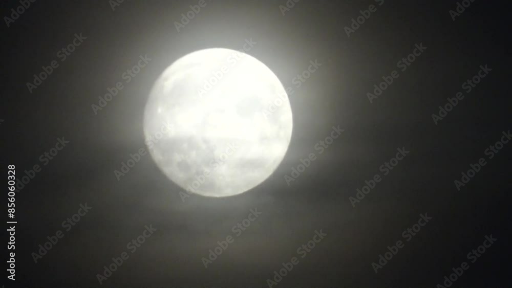 Dark night sky, moving clouds and moon during full moon with glow around in October called Hunter’s Moon or Harvest Moon - timelapse. Topics: astronomy, moonlight, season, cosmos, weather Dark night sky, moving clouds and moon during full moon with glow around in October called Hunter’s Moon or Harvest Moon - timelapse. Topics: astronomy, moonlight, season, cosmos, weather