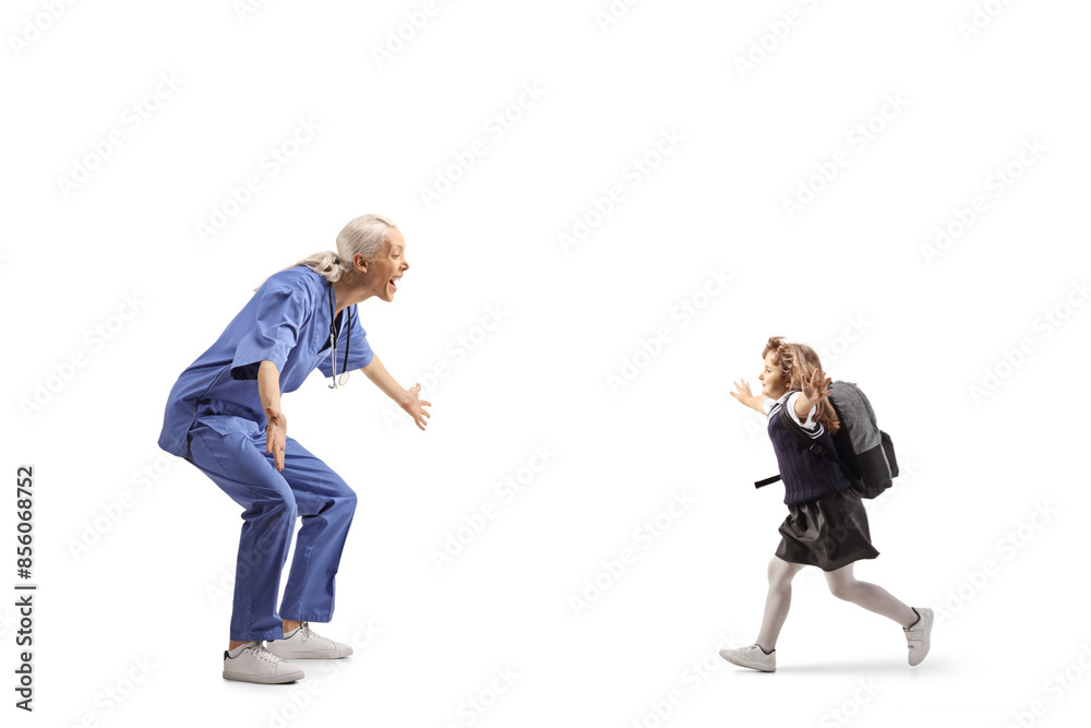 Profile shot of a happy female nurse waiting to hug a kid Profile shot of a happy female nurse waiting to hug a kid