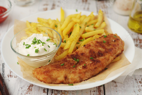 Fish and chips served on the plate, traditional dish of Great Britain 