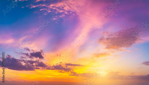 breathtaking fantasy sunset sky with vibrant rich hues of purple, pink, and yellow, creating a stunning gradient. The panoramic view evokes a sense of wonder and tranquility