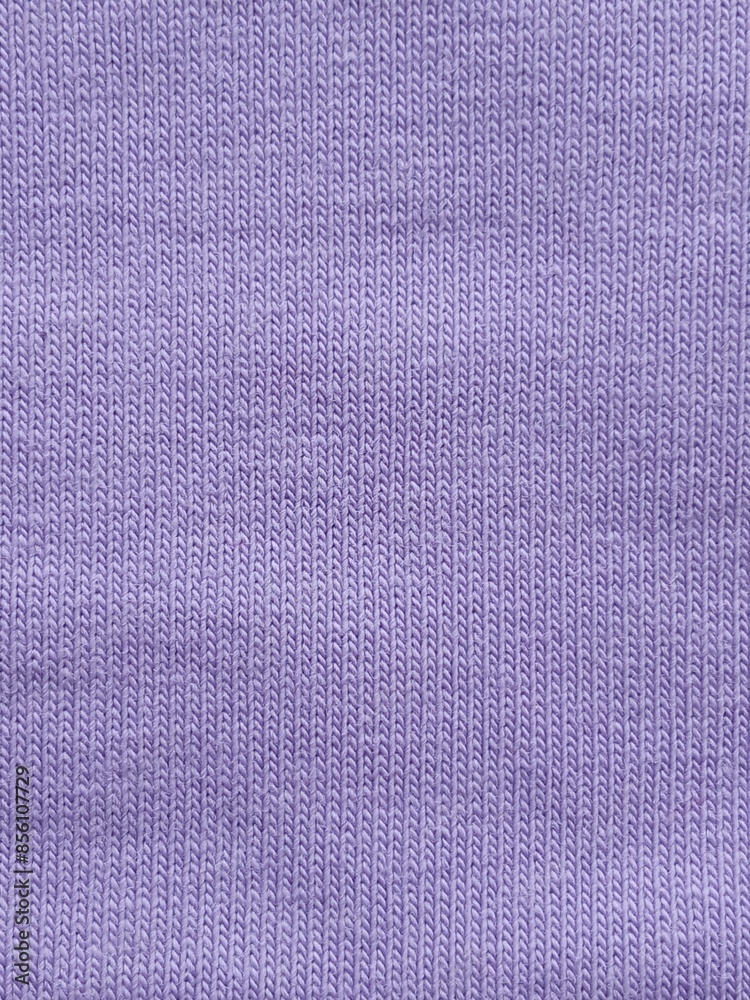 Fototapeta premium Footer fabric close-up. The texture of the fabric is purple, lavender in color. Sewing. Background.