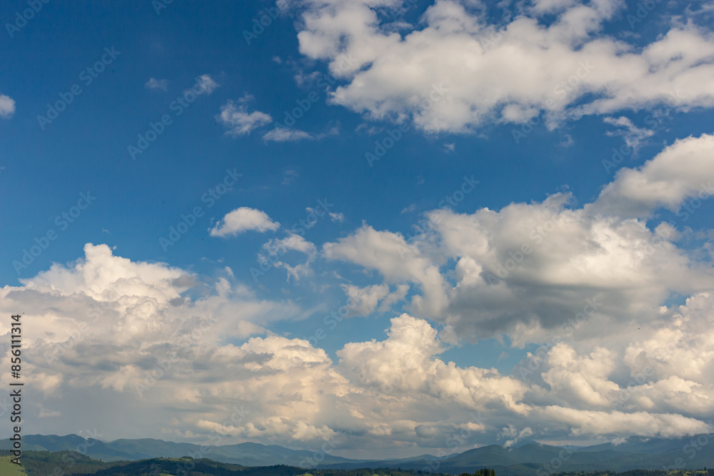 The most beautiful landscape in the mountains, the sky with clouds on a sunny day.