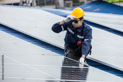 Wallpaper Mural Professional Engineer Service Solar Panel. Worker Maintenance Cleaning Replacing Solar Panel. Solar photovoltaic panel system in Industry roof. Saving Energy with Clean Power. Torontodigital.ca
