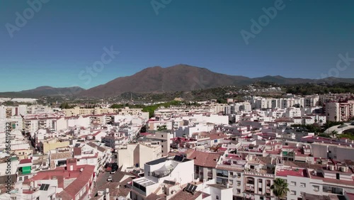 Wallpaper Mural Panoramic coastal city view with mountains, urban architecture, rooftops, and clear sky Torontodigital.ca