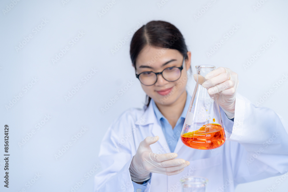 Scientist woman holding chemical test liquid glass tube testing science laboratory. Scientist woman holding chemical test liquid glass tube testing science laboratory.