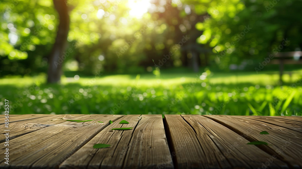 A wooden table with a view of a lush green field. The table is empty and the grass is green and full A wooden table with a view of a lush green field. The table is empty and the grass is green and full