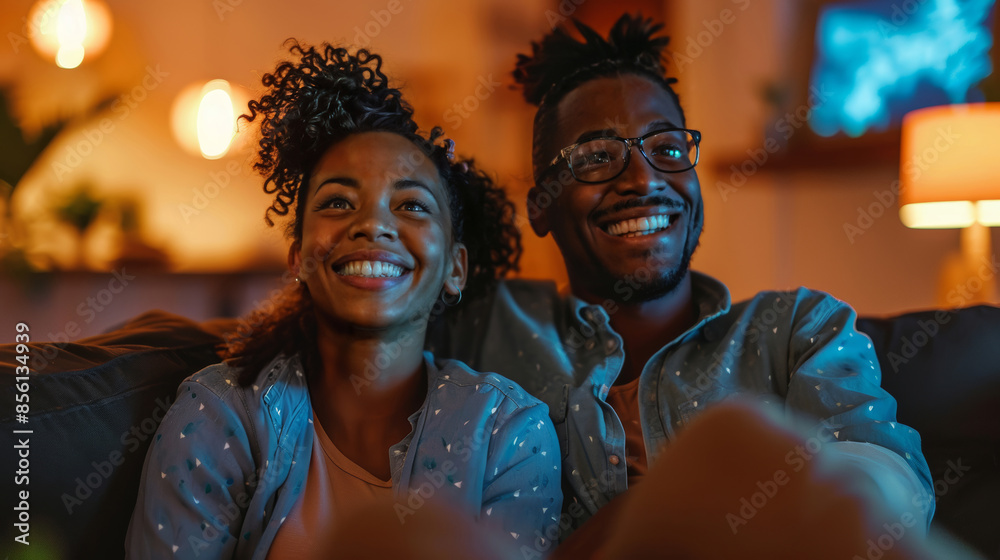 Joyful Movie Night: Couple Enjoying a Film at Home Joyful Movie Night: Couple Enjoying a Film at Home