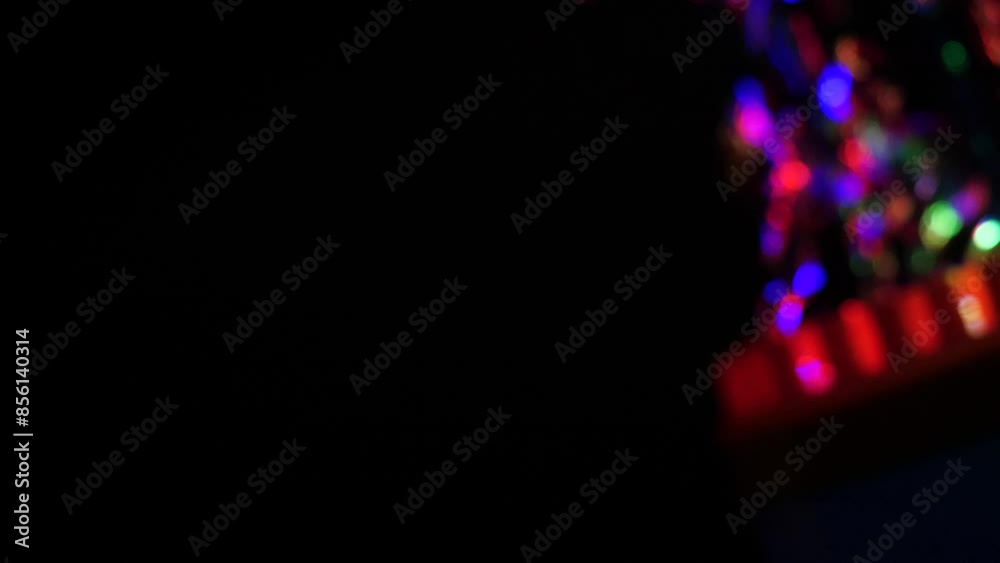 Toy soap bubble machine with colorful LED lights in action, close-up. Kids' party concept Toy soap bubble machine with colorful LED lights in action, close-up. Kids' party concept