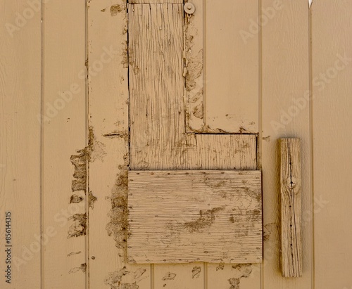 Fotografija An old wooden barn wall, weathered and rustic, tells a story of time with its aged, textured planks, offering a charming, nostalgic glimpse into rural history