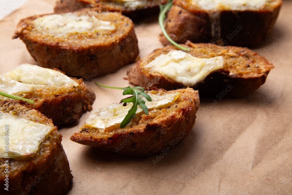 Gourmet toast medley with melting brie cheese and aromatic herbs Gourmet toast medley with melting brie cheese and aromatic herbs