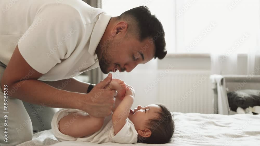 Dad playing with his baby daughter at home
Dad playing with his baby daughter at home