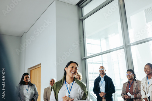 Smiling businesswoman speaker interacting with team during a conference Free Download Smiling businesswoman speaker interacting with team during a conference - GFXLoad