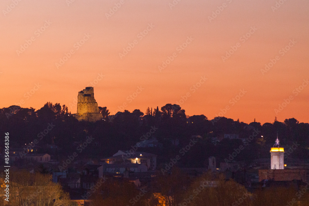 Fototapeta premium The Magne tower overlooking the city of Nimes at sunset