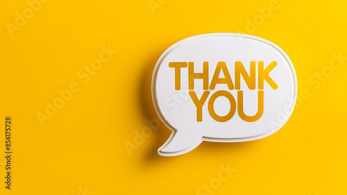 A white speech bubble with the word THANK YOU on a yellow background.