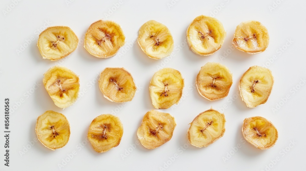 Banana chips displayed on a white backdrop Banana chips displayed on a white backdrop