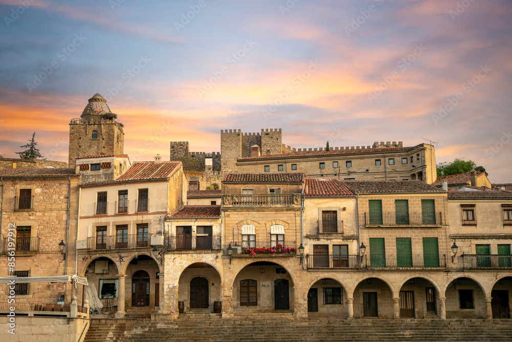 View of one of the arcaded sides of the Plaza Mayor of Trujillo, Cáceres, Extremadura, Spain, with the medieval citadel in the background
