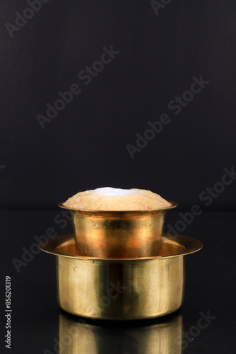 South Indian Filter coffee served in a traditional brass or stainless steel cup