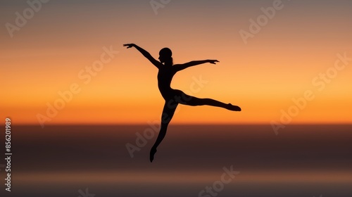 Wallpaper Mural Acrobat in silhouette performing a flawless pose, suspended in mid-air with a serene dusk sky behind, showcasing agility and grace in perfect harmony Torontodigital.ca