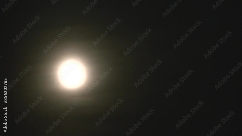 Dark night sky, moving clouds and moon during full moon with glow around in October called Hunter’s Moon or Harvest Moon - timelapse. Topics: astronomy, moonlight, season, cosmos, weather Dark night sky, moving clouds and moon during full moon with glow around in October called Hunter’s Moon or Harvest Moon - timelapse. Topics: astronomy, moonlight, season, cosmos, weather