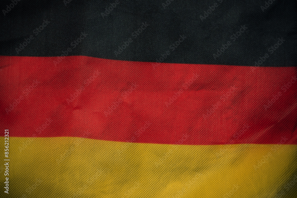 Obraz premium Germany nation flag on crumpled fabric background , country flag