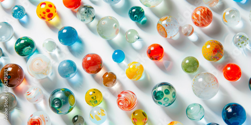 Multicolored Glass Balls On A White Background With A Top View For Wallpaper Created Using Artificial Intelligence