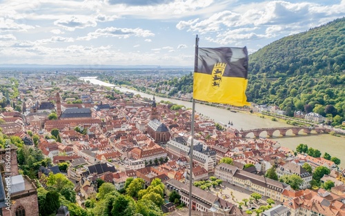 Aerial view of Heidelberg, Germany with the old town, river Neckar, and a flag of Baden-Wurttemberg photo