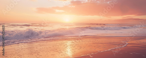 A serene beach sunset background with warm orange and pink hues, gentle waves, and textured sand. The peaceful, picturesque view creates a relaxing, tranquil scene.