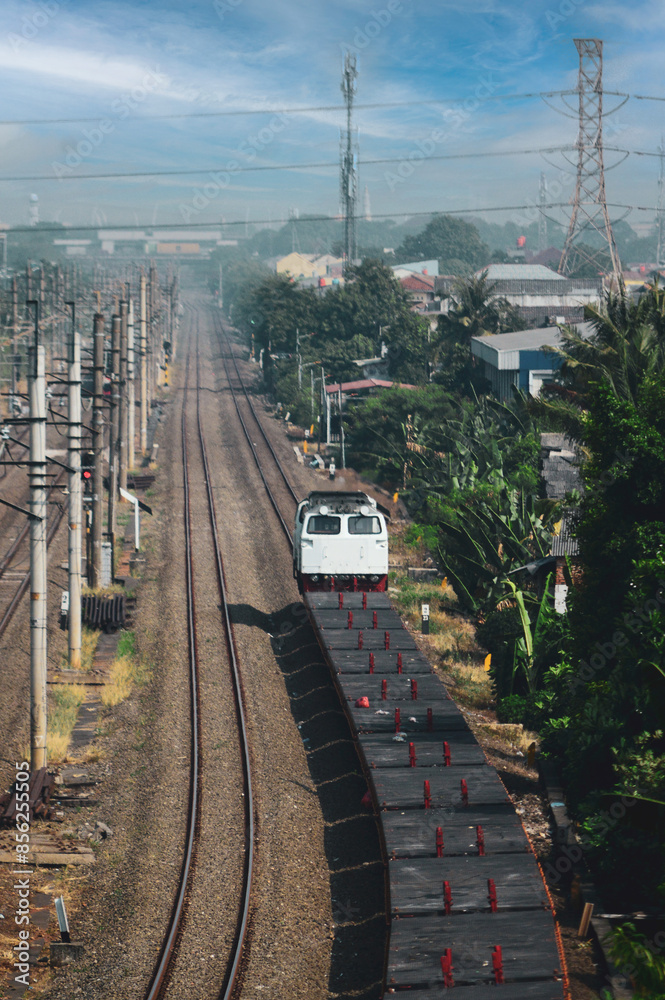 Obraz premium View of a passenger train traveling in a rural area