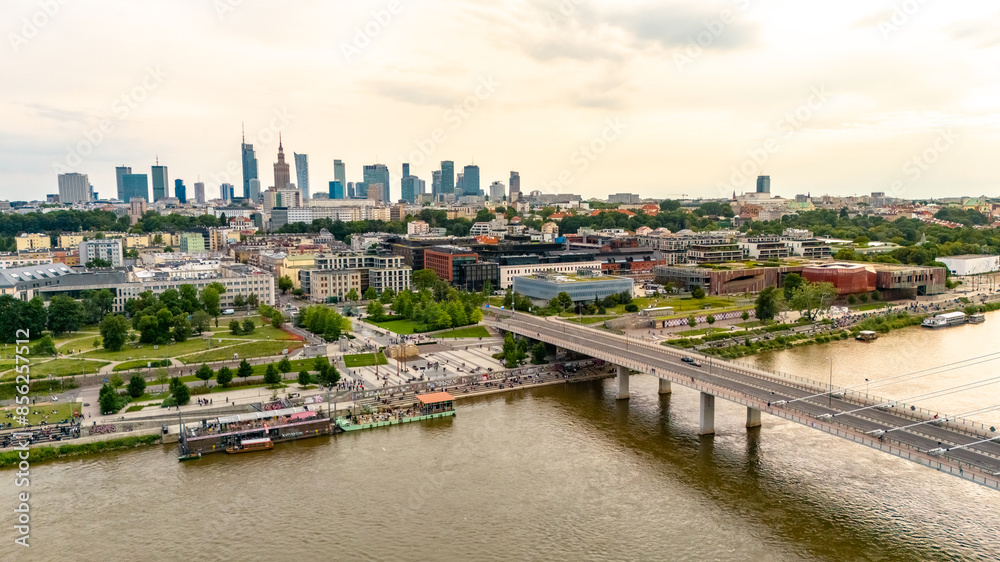 Obraz premium panoramic aerial view of Warsaw city at sunset in summer over the river