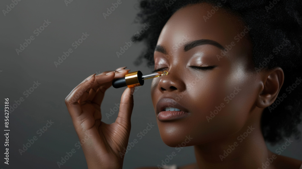 Obraz premium A person delicately applying makeup with a dropper, exuding elegance and care in a poised and serene setting, highlighting beauty and self-care.