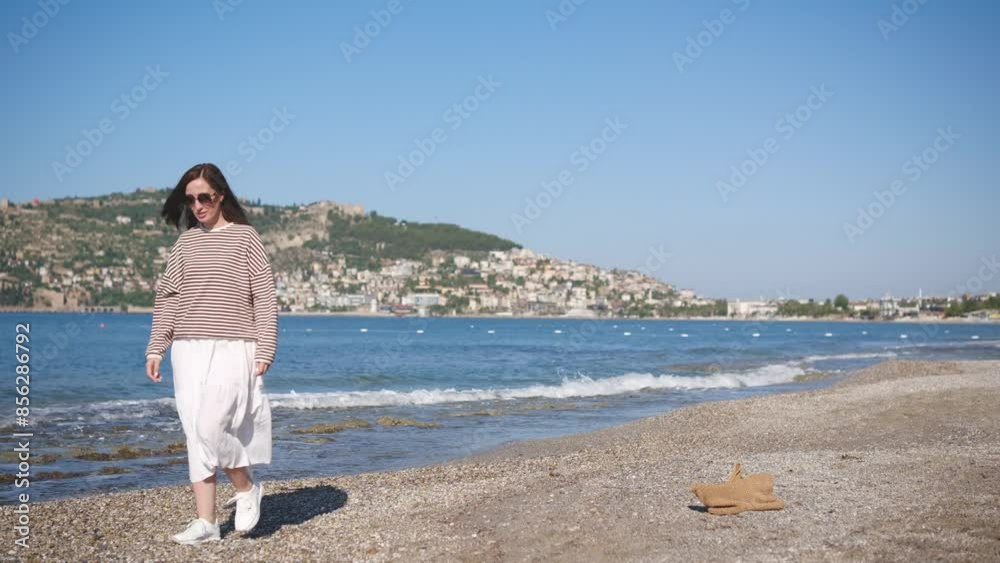 Happy traveller woman walking and enjoying Mediterranean Sea beach vacation. Happy traveller woman walking and enjoying Mediterranean Sea beach vacation.