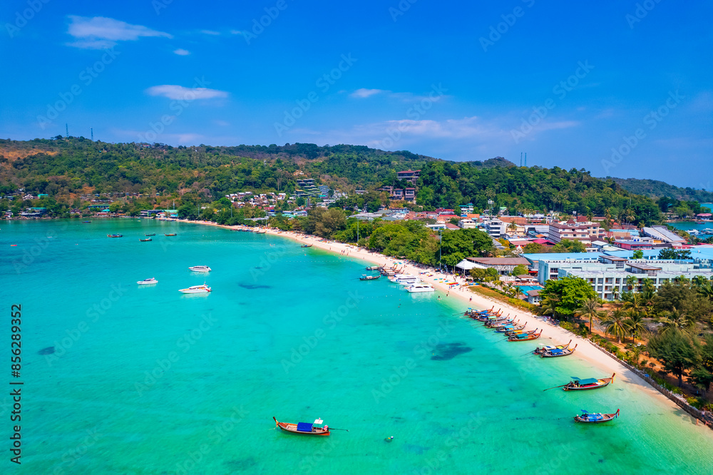 longtail boat turquoise clear water in Phi Phi, Krabi Thailand. Amazing travel landscape photo in Thai