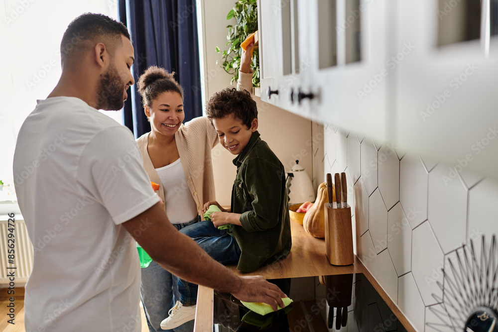 custom made wallpaper toronto digitalA man and woman cleaning and organizing a kitchen together with son.