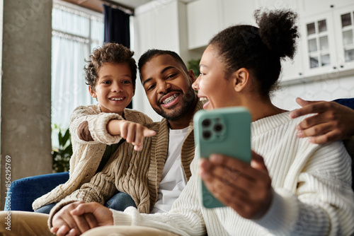 Εκτύπωση καμβά African American family joyfully taking selfie together with cell phone