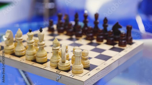 Wallpaper Mural Chess tournament, kids and adults participate in chess match game in indoor hall, players of all ages play, competition in chess school club with chessboards on a table, wooden pieces on checkerboard Torontodigital.ca