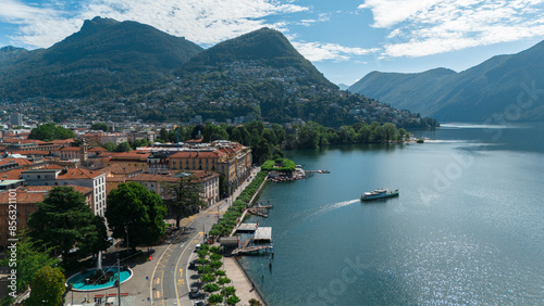 Ferry leaving the harbor in Lugano, Switzerland, Scenic Aerial Drone Photo