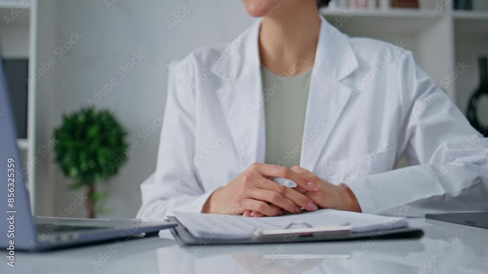 Medic explaining treatment online by laptop in clinic closeup. Woman doctor Medic explaining treatment online by laptop in clinic closeup. Woman doctor