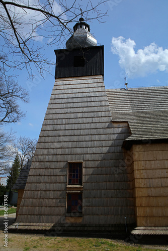 Fototapeta Naklejka Na Ścianę i Meble -  The oldest wooden Catholic church in Bieszczady Mountains in Srednia Wies village, Poland
