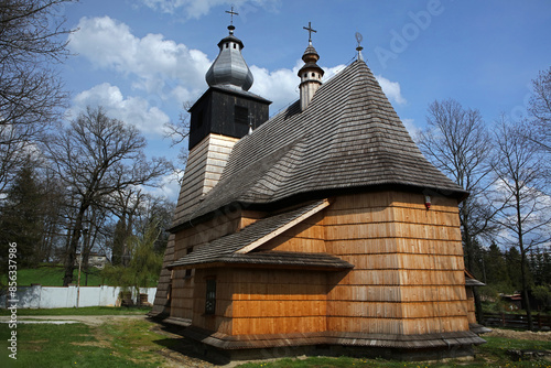 Fototapeta Naklejka Na Ścianę i Meble -  The oldest wooden Catholic church in Bieszczady Mountains in Srednia Wies village, Poland