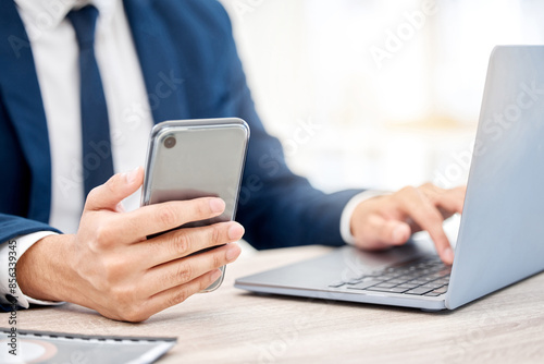 Hands, business and man with smartphone, laptop and internet for social media, research and investment. Person, closeup or employee with cellphone, tech or digital app for texting, trading or contact
