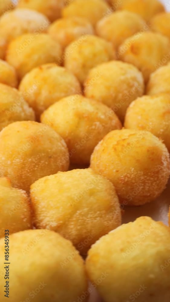 Cooking Thai fried sweet potato balls. Popular street food. Fried potato balls,rotation in circle. Potato Balls, Turning. Vertical video Cooking Thai fried sweet potato balls. Popular street food. Fried potato balls,rotation in circle. Potato Balls, Turning. Vertical video