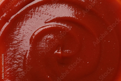 Fototapeta Naklejka Na Ścianę i Meble -  Texture of tasty ketchup as background, top view. Tomato sauce