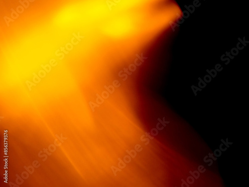 Light orange warm color light leak on dark background for design use and special effects.