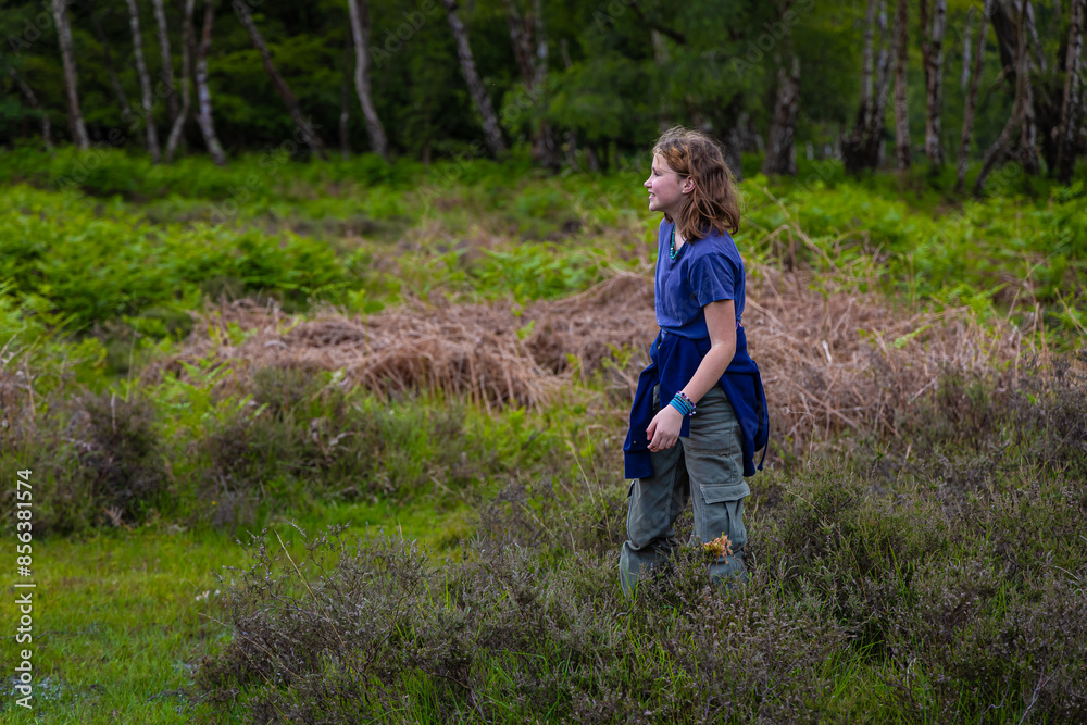 Girl in New Forest national park in summer, England Girl in New Forest national park in summer, England