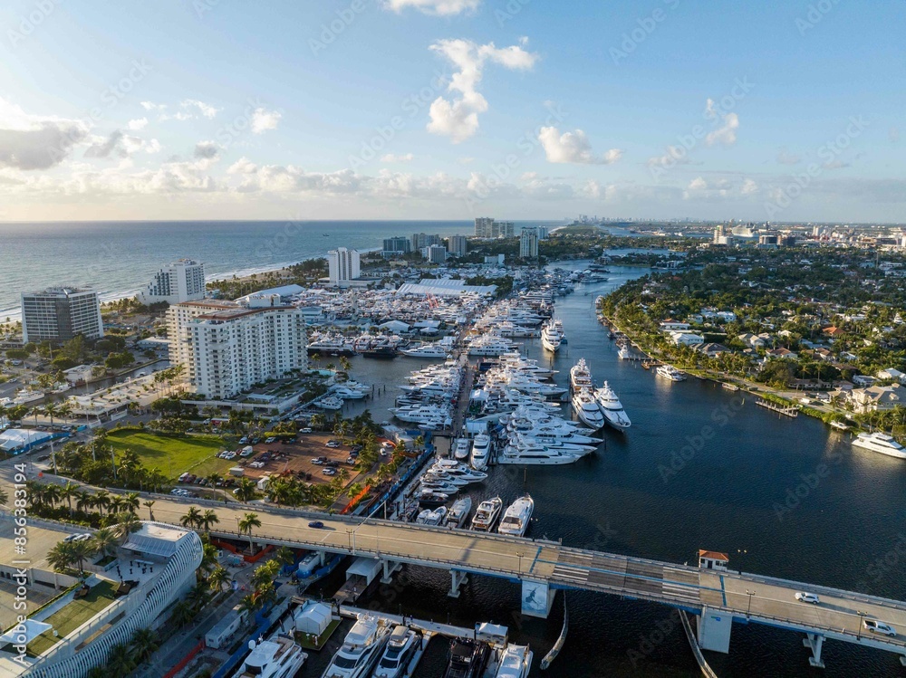Obraz premium epic drone capture of beach with multiple boats throughout entire frame