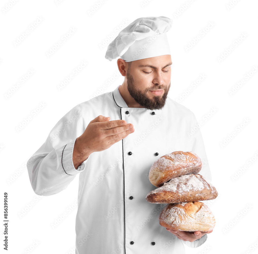 Male baker with loaves of fresh bread on white background Male baker with loaves of fresh bread on white background