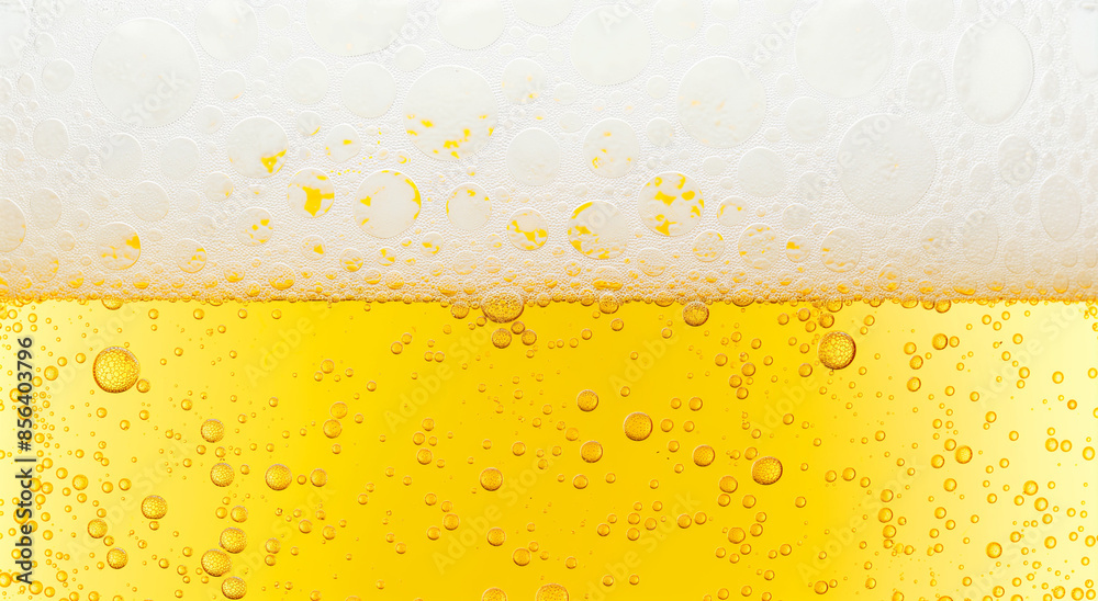 Beer background texture. Close up beer gluss with frothy foam and bubbles Beer background texture. Close up beer gluss with frothy foam and bubbles