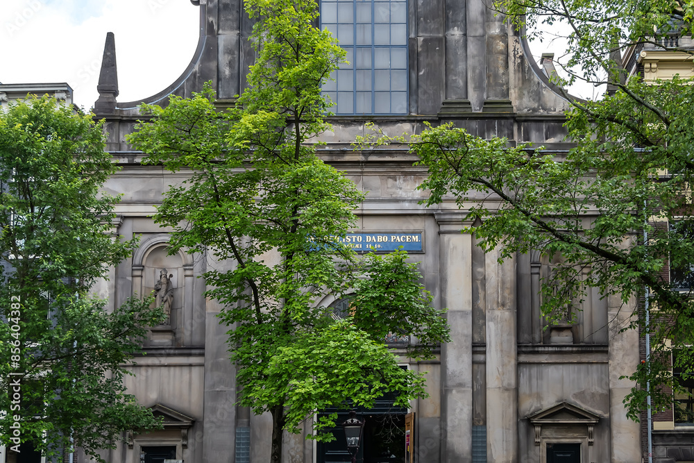 Fototapeta premium De Duif is a church on the Prinsengracht in Amsterdam. De Duif is built in the neo classicist style in 1858 as the Roman Catholic. Amsterdam, the Netherlands.